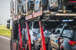 Vehicles loaded on the decks of an open car carrier