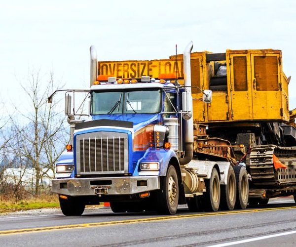 Construction equipment shipping image for an asphalt paver transport guide