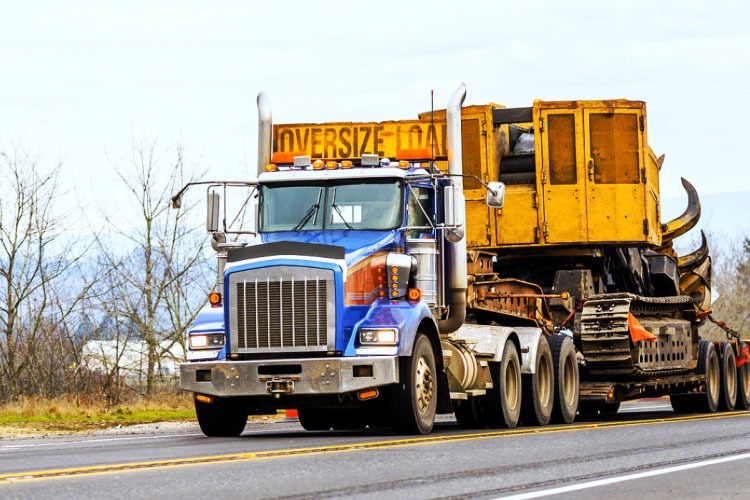 Construction equipment shipping image for an asphalt paver transport guide
