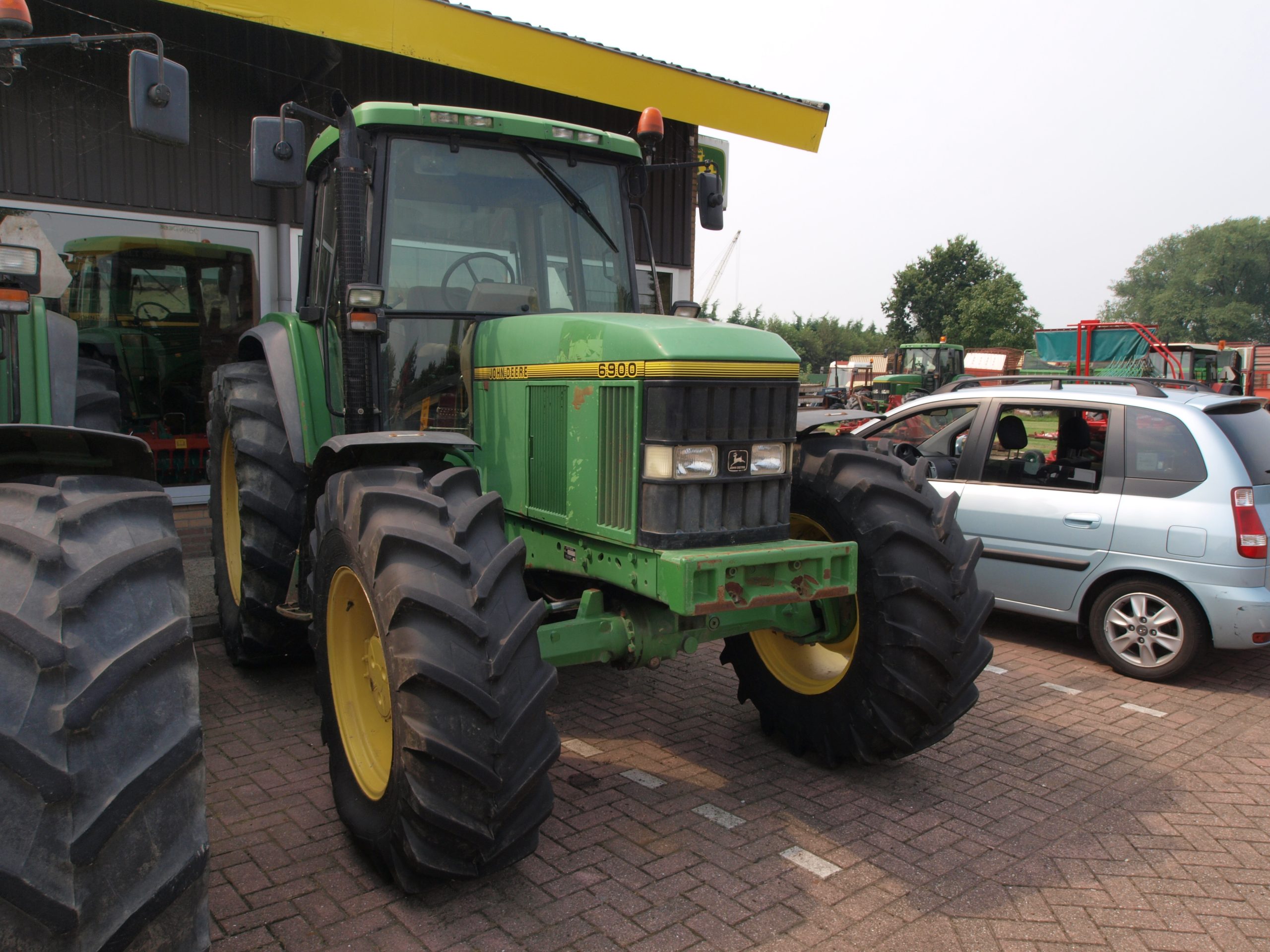 John Deere tractor for agricultural equipment transport