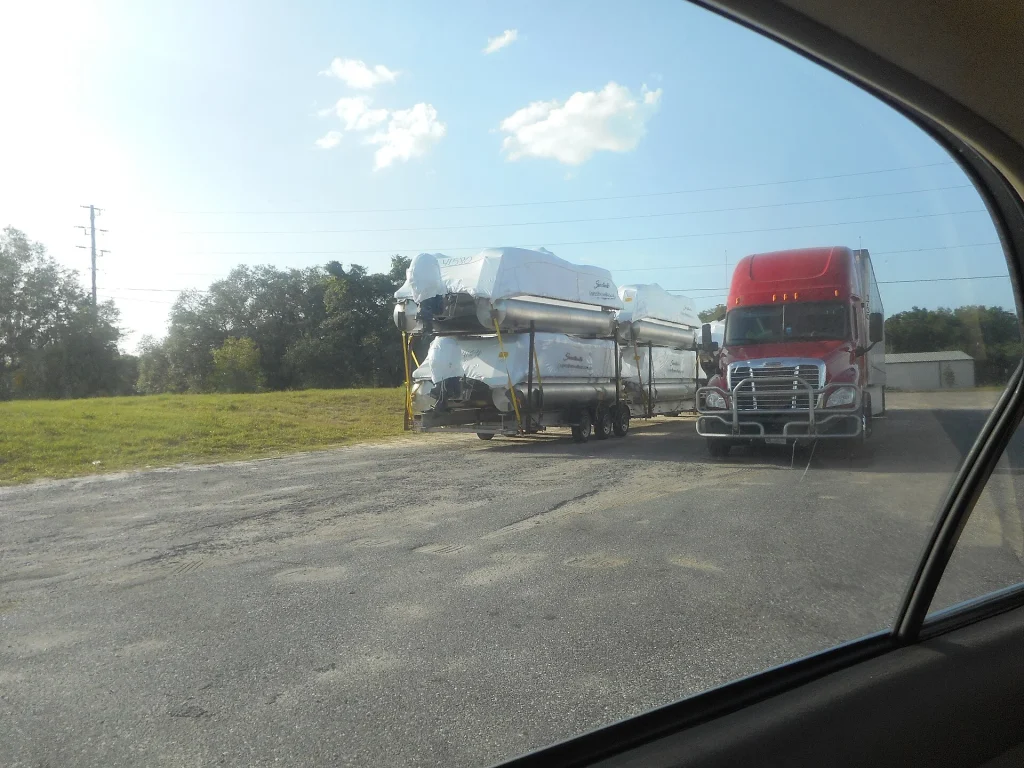 Heavy-duty pickup hauling a boat on a road trailer